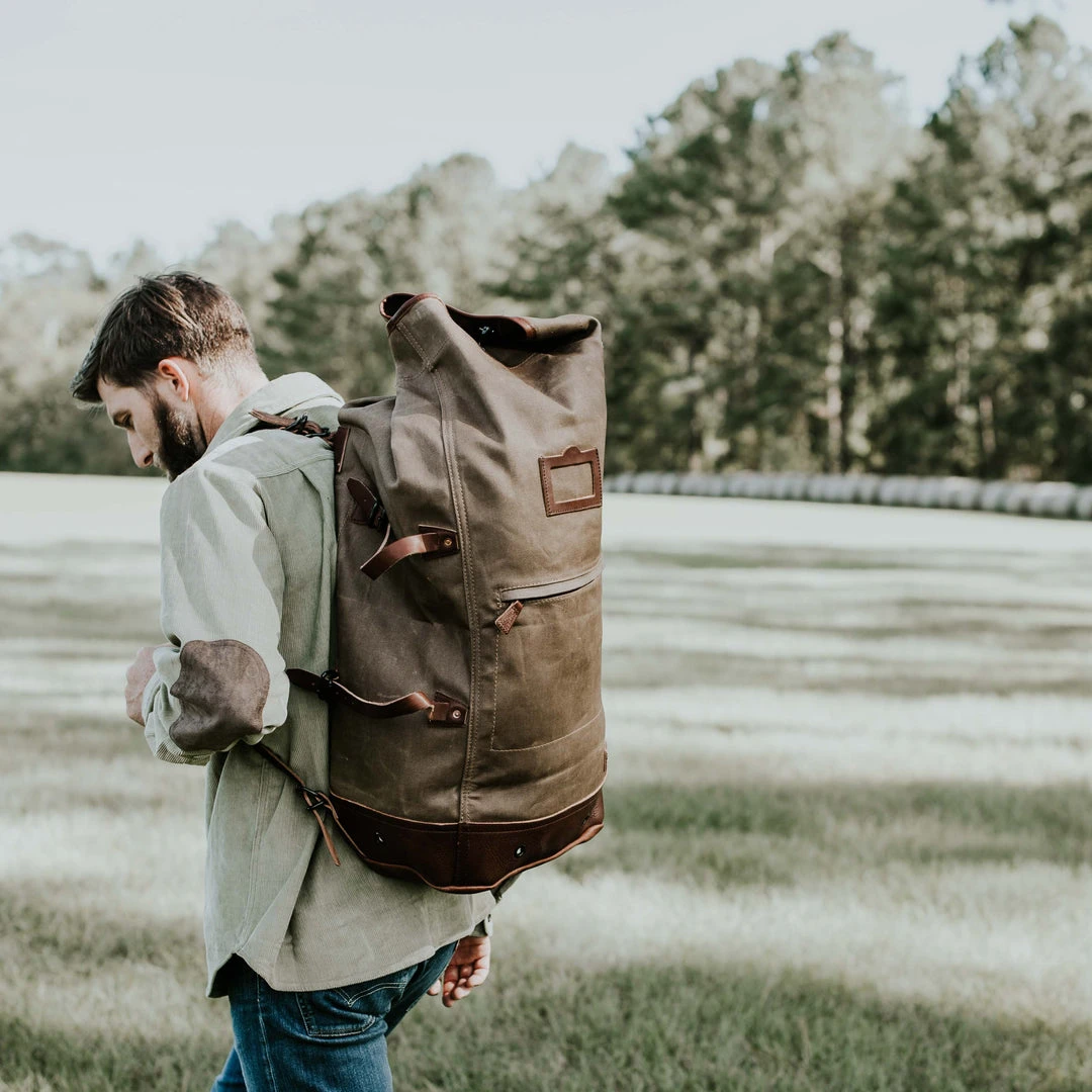 Buffalo Jackson Trading Co. Dakota Waxed Canvas Military Sea Bag Backpack | Field Khaki W/ Chestnut Brown Leather Buffalo Jackson Trading Co. Dakota Waxed Canvas Military Sea Bag Backpack | Field Khaki W/ Chestnut Brown Leather