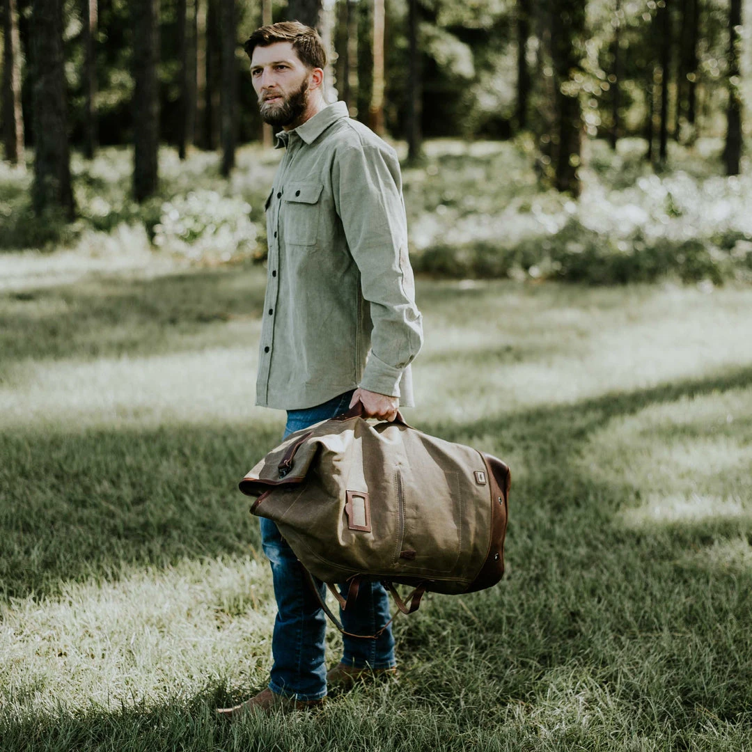 Buffalo Jackson Trading Co. Dakota Waxed Canvas Military Sea Bag Backpack | Field Khaki W/ Chestnut Brown Leather Buffalo Jackson Trading Co. Dakota Waxed Canvas Military Sea Bag Backpack | Field Khaki W/ Chestnut Brown Leather
